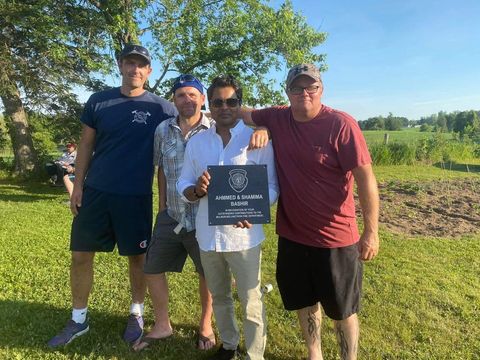 Bashir Ahmmed receiving recognition from the Mulmur-Melancthon Fire Department.